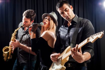 three people performing on stage