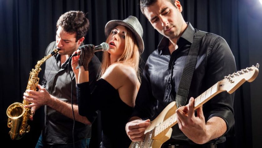 three people performing on stage